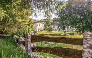 a painting of a wooden bridge in front of a house at Ostoja Szmana in Węgorzyno