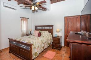 Ένα ή περισσότερα κρεβάτια σε δωμάτιο στο Gecko Getaway condo