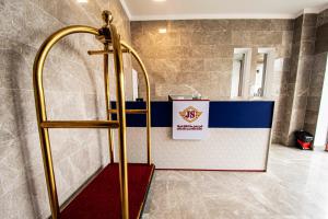 a shower in a bathroom with a counter in a room at JS2 شموخ جندول صلاله in Salalah