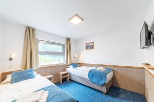 Postel nebo postele na pokoji v ubytování Botel Racek