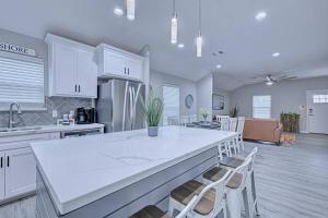 a kitchen with a large white island in a room at 2022 Built Modern Family-Friendly Oasis in Corpus Christi