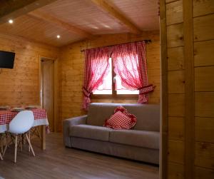 a living room with a couch and a window at Le Farine Del Maestro in Barete