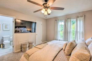 a bedroom with a bed and a ceiling fan at Updated Retreat 2 Mi to Truist Park and Battery in Atlanta