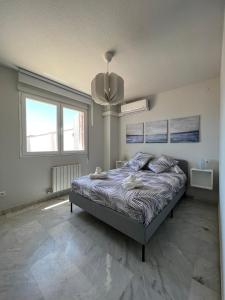 A bed or beds in a room at Preciosa vivienda con gran terraza, parking gratis