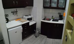 A kitchen or kitchenette at Smart apartment, Athens.