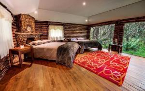 Postel nebo postele na pokoji v ubytování Polylepis Lodge + 37 fotografií