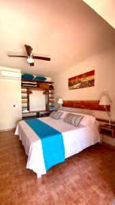 a bedroom with a large bed in a room at CAN DAMIA 1 in Cala Saona