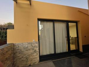 a house with a large sliding glass door at Beautiful View 1 - Arco da Calheta - Ilha da Madeira in Arco da Calheta +45 photos