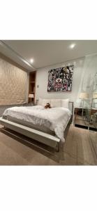 a bedroom with a bed with a dog laying on it at Central London 1 bed Apartment in London