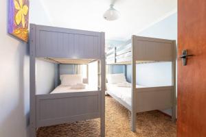a couple of bunk beds in a room at Kangaroo Pause -Home with yard & parking -Free wine in Hope Valley