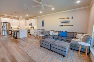 a living room with a couch and a kitchen at Private Pool Magnolia's Coastal Escape in Corpus Christi