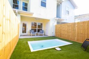 a backyard with a swimming pool and a fence at Private Pool Magnolia's Coastal Escape in Corpus Christi