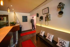 a mannequin is standing in a room with a bar at Otto's Parkhotel Saarlouis in Saarlouis