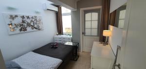 Postel nebo postele na pokoji v ubytování La Rosa de los vientos luxury apartment