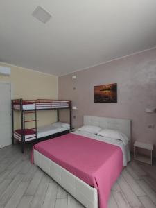 Postel nebo postele na pokoji v ubytování Villa Ormeni