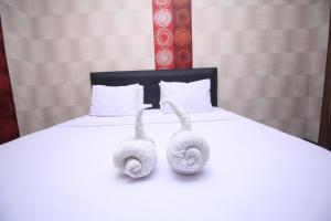 Llit o llits en una habitació de Tangkoko Lodge