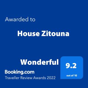 a blue screen with the words awarded to a house zirulino at House Zitouna in Marrakesh
