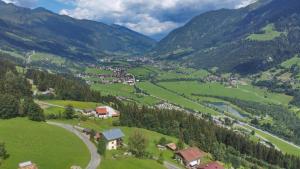 a small village in a valley in the mountains at Ferienwohnung Oberrauter in Bad Gastein