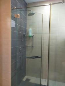 a shower with a glass door in a bathroom at Shaftsbury Residence Cyberjaya Wifi, Netflix, Free Parking in Cyberjaya