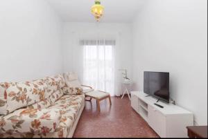 Televízia a/alebo spoločenská miestnosť v ubytovaní Precioso y luminoso apartamento Calle Corredera. Casco Histórico