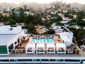 an aerial view of a building with a swimming pool at Andaz West Hollywood-a concept by Hyatt in Los Angeles