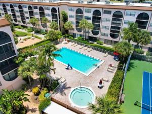 an overhead view of a swimming pool in a apartment complex at Pleasant condo with spectacular views, pools and spas in Marco Island