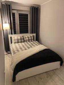 Postel nebo postele na pokoji v ubytování Apartament Bieszczadzkie Marzenie, Netflix