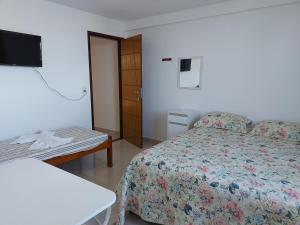 Postel nebo postele na pokoji v ubytování Casarão Nazaré Hostel + 1 fotografie