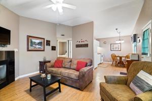 a living room with a couch and a table at Wilstem Cabins in French Lick