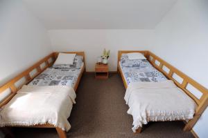 Postel nebo postele na pokoji v ubytování Hortenzie