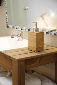 a wooden table in a bathroom with a sink at Studio Toro in El Chalten