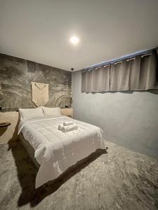 Voodi või voodid majutusasutuse Ariché Valladolid Hotel & Hostal toas