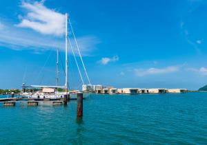 a sail boat docked at a dock in the water at Marina Puerto Velero in Tubará