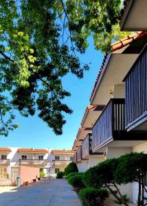 a row of apartment buildings with balconies at Hotel Inn Santa Fe in Santa Fe