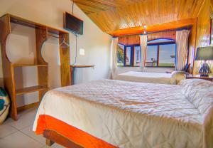 Voodi või voodid majutusasutuse Hotel Don Taco toas