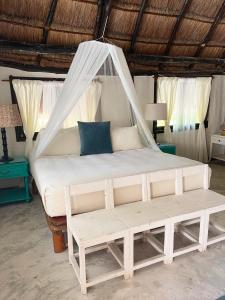 En eller flere senger på et rom på Sivana Tulum