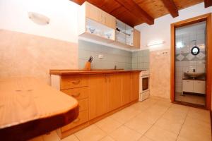 a kitchen with a counter and a sink in it at Apartments by the sea Tkon, Pasman - 19024 in Tkon