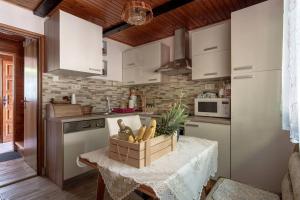 a kitchen with a table with a box on it at Family friendly house with a parking space Donja Stubica, Zagorje - 19236 in Donja Stubica