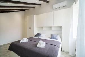 Postel nebo postele na pokoji v ubytování Apartments by the sea Slano, Dubrovnik - 19167