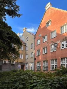 un grupo de edificios contiguos en Apartament Hansa Klossa, en Olsztyn