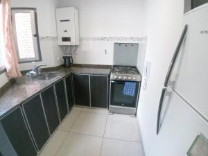 Nhà bếp/bếp nhỏ tại Departamento de Categoria Zona Centro