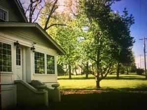 a house with a couch sitting outside of it at Country House on 1 Acre 4 Beds Great for Events or a quiet weekend! in Independence