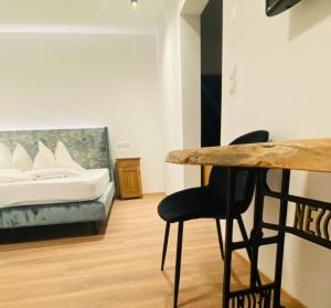 Ένα ή περισσότερα κρεβάτια σε δωμάτιο στο Hotel Garni Vinea Montis