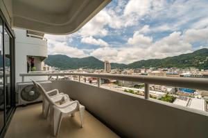 a balcony with a view of a city at Patong Tower Condominium by Lofty in Patong Beach