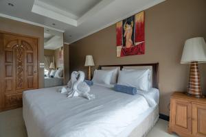 Ένα ή περισσότερα κρεβάτια σε δωμάτιο στο Patong Tower apartment by Lofty +28 φωτογραφίες