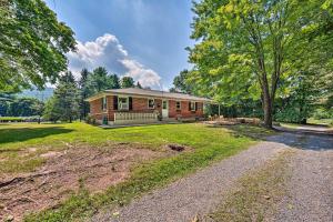 a large house with a driveway in front of it at Peaceful Home with Patio and Fire Pit on 2 Acres! in Dauphin