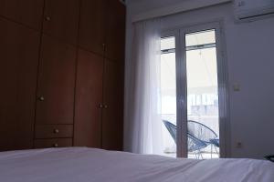 Posteľ alebo postele v izbe v ubytovaní Penthouse with Acropolis View