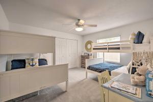 a bedroom with two bunk beds and a table at Crystal River Gem Near Three Sisters Springs! in Crystal River