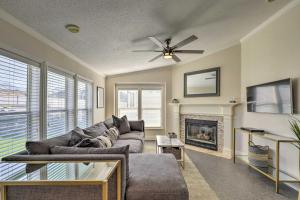 a living room with a couch and a fireplace at Lovely Lehi Retreat 27 Mi to Alta Ski Area! in Lehi
