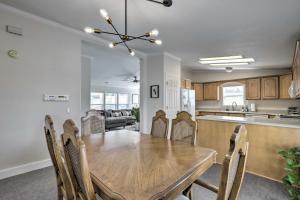 a kitchen and dining room with a wooden table and chairs at Lovely Lehi Retreat 27 Mi to Alta Ski Area! in Lehi